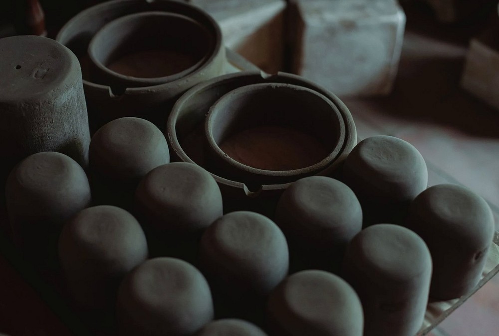 Detailed view of clay pottery showing craftsmanship in a workshop setting.